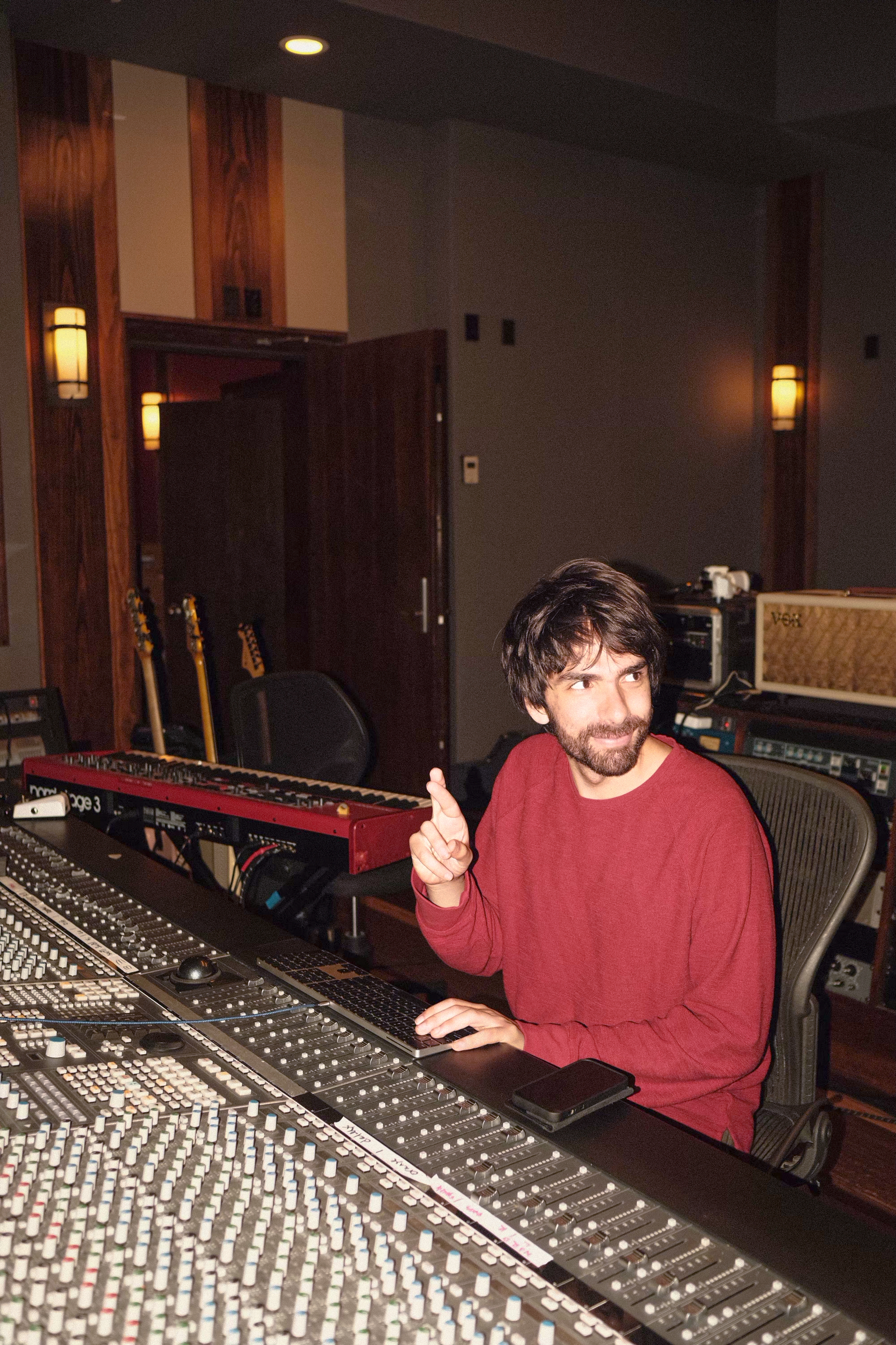 Oliver crossing his fingers in the studio